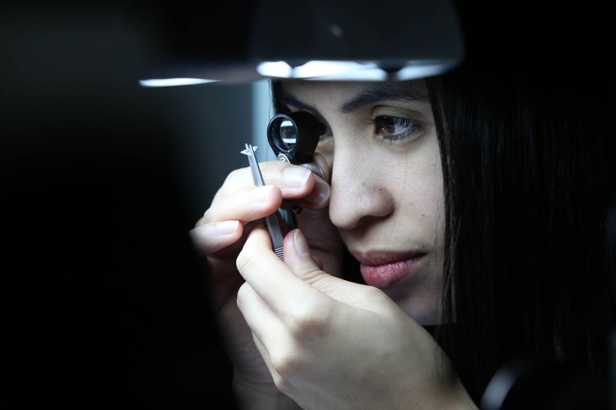 Loupe being used to view diamond