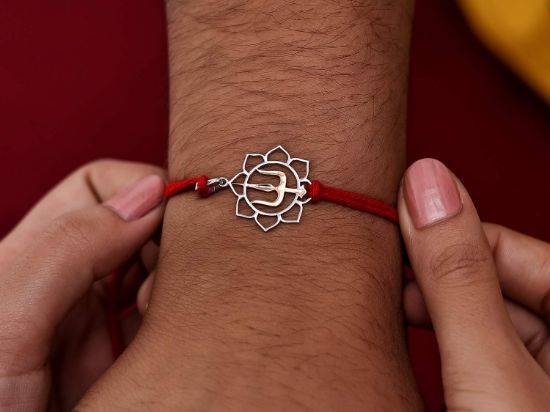 Thrishul Silver Rakhi Pendant on wrist