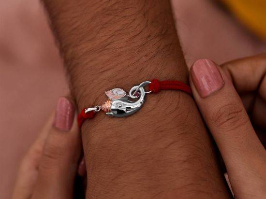 Gaja-Krishn Silver Rakhi Pendant on wrist